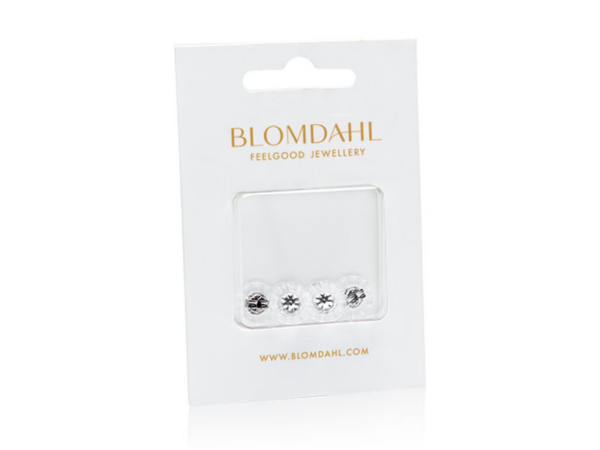 Latched & Bloom Packaging of Earring Backings - Implant Grade Titanium, featuring three pairs of silver stud earrings displayed against a white background. Pediatric and Postpartum Care